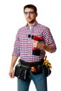 Worker holding cordless screwdriver. handyman wearing tool belt Royalty Free Stock Photo