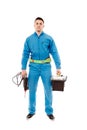 Worker holding a drill and a tool box Royalty Free Stock Photo