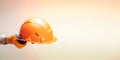 worker holding helmet close up. banner with copy space Royalty Free Stock Photo