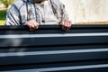 Worker holding metal sheet on grass background Royalty Free Stock Photo