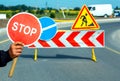 Worker holding a stop sign during road construction. Royalty Free Stock Photo