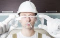 Worker holding transparent safety glasses Royalty Free Stock Photo