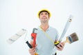 Worker holding various equipment over white background Royalty Free Stock Photo