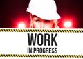 Worker holding work in progress sign on information board Royalty Free Stock Photo