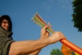 a worker holds a multi-core multi-colored optical cable in his hands Royalty Free Stock Photo