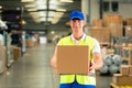 Worker holds package in warehouse of forwarding