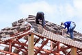 Worker install roof tile for new house