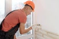 The worker is installing brick tiles on the wall Royalty Free Stock Photo