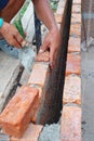 Worker is installing the bricklayer of the wall