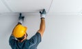 Worker Installing Ceiling Panels in Construction Site Royalty Free Stock Photo