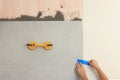Worker installing ceramic tile on wall indoors, closeup Royalty Free Stock Photo