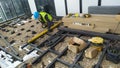Worker installing decks on the building roof using the tools