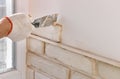 A worker is installing  brick tiles on the wall Royalty Free Stock Photo