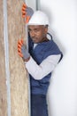 worker installing insulation panels mineral wool Royalty Free Stock Photo