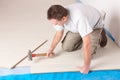 Worker installing a laminated flooring Royalty Free Stock Photo