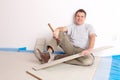 Worker installing a laminated flooring Royalty Free Stock Photo