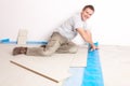 Worker installing a laminated flooring Royalty Free Stock Photo