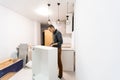 Worker installing new countertop in modern kitchen Royalty Free Stock Photo