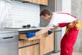 Worker installing new countertop in modern kitchen Royalty Free Stock Photo