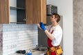 Worker installing new countertop in modern kitchen Royalty Free Stock Photo