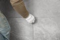 Worker installing new wall tile, closeup. Prepared for renovation Royalty Free Stock Photo