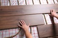 Worker installing new wooden laminate over underfloor heating system, closeup Royalty Free Stock Photo