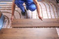 Worker installing new wooden laminate over underfloor heating system Royalty Free Stock Photo