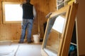 Worker installing new wooden windows Royalty Free Stock Photo