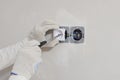 Worker installing the power outlet, close up Royalty Free Stock Photo