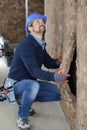 worker installing rock wool insulation in wooden frame Royalty Free Stock Photo