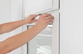 Worker installing roller window blind indoors, closeup Royalty Free Stock Photo