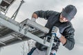 Worker Installing Scaffolding