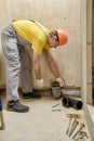 The worker is installing a sewage drain pipe Royalty Free Stock Photo