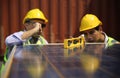 Worker is installing solar panel, technician installing solar panels on roof. Alternative energy sun energy power, ecological con Royalty Free Stock Photo