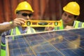 Worker is installing solar panel, technician installing solar panels on roof. Alternative energy sun energy power, ecological con Royalty Free Stock Photo