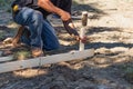 Worker Installing Stakes and Lumber Guides At Construction Site