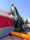 Worker installing a tent on a residential villa for termite fumigation Royalty Free Stock Photo