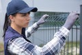worker installing welded metal mesh fence Royalty Free Stock Photo