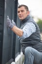 worker installing welded metal mesh fence Royalty Free Stock Photo