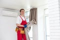 worker installing window curtain rod on the wall