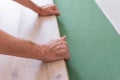 Worker installing wooden laminate flooring Royalty Free Stock Photo