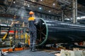 Worker installs clamping ring on coated pipe