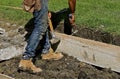 Worker installs forms for curb project