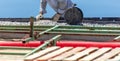 A worker installs formwork at a construction site Royalty Free Stock Photo