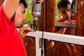 A worker installs new plastic windows in the house, drills holes in the window with a hand-held electric drill Royalty Free Stock Photo