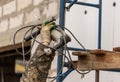 Worker insulates the walls of the house with plastic panels