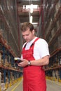 Worker with inventory device Royalty Free Stock Photo