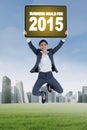 Worker jumps with business goals for 2015