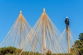 Worker at Kanazawa`s Famous Kenrokuen Gardens tying Yukitsuri ropes to the trees