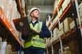 Worker with laptop computer in mail order warehouse Royalty Free Stock Photo